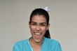 © dtiberio - Hispanic Female Nurse Laughing