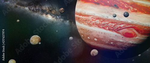 Photographie planet Jupiter with some of the 69 known moons with the Milky Way galaxy