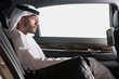 © phocal Media - Emirati businessman traveling in car.