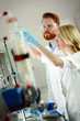 © NDABCREATIVITY - Group of chemistry students working in laboratory