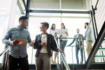 Wall Mural - Picture of business colleagues talking in office