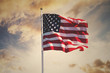 Leinwandbild Motiv american flag waving in the sky, toned wth instagram filter