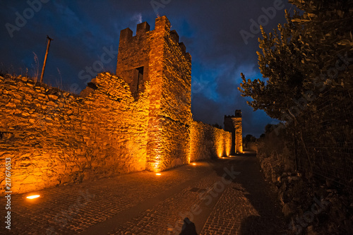 Fotografie, Obraz Night view of the ancient medieval walls of Iglesias in Sardinia, Italy