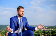 Businessman Formal Suit Sit Lotus Pose And Meditating Outdoors. Entrepreneur Find Minute To Relax And Meditate. Man Try To Keep His Mind Clear. Relaxation Technique. Keeping Calm Inside His Soul