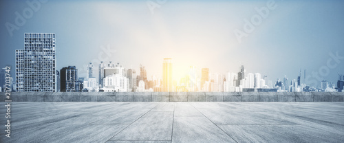 Cuadros en Lienzo Rooftop with sunset city wallpaper