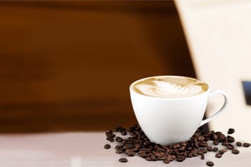 Canvas Print - Coffee cup and coffee beans on desk