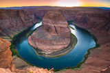 Fototapeta  - Horseshoe Bend is a beautiful horse-shoe-shaped water meander made by the Colorado River in Arizonian red rock desert landscape, close to Page, Arizona, USA. Scenic view from steep cliffs above