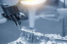 The Robot For Manufacturing  The Aluminum Automotive Part .The Automotive Part Quality Control Concept.