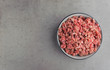 Natural raw ingredients for pet food on grey background.