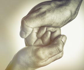 Wall Mural - Male and female hands connect with each other. Black and white image.