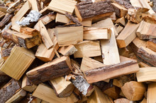 The Texture Of The Wooden Chopped Logs Sticks For Burning The Furnace. The Background
