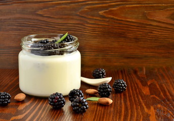 Wall Mural - Homemade yogurt in small jars with berries, fruits, almonds,  copy space