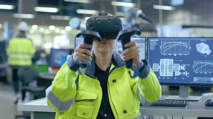 Fototapete - Portrait Female Mechanical Engineer Wearing Virtual Reality Headset and Making Gestures with Controllers, She Uses VR technology for Industrial Design, Development and Prototyping in CAD Software. 