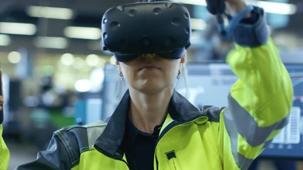 Fototapete - Portrait Female Mechanical Engineer Wearing Virtual Reality Headset and Using Controllers, She Uses VR technology for Industrial Design, Development and Prototyping in CAD Software.  