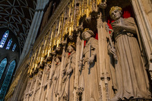 Beautiful View Of The Statues Of The Kings On The Choir Screen And Stained Glass Window Of York Monster Cathedral In Yorkshire, England UK