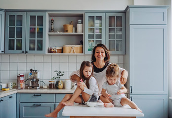 Happy family having fun in the kitchen