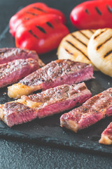 Canvas Print - Grilled beef steak with bell peppers and cheese