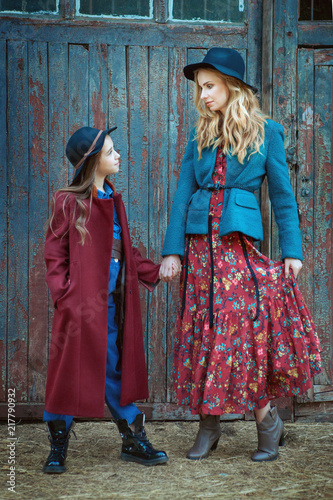 Fotografie, Obraz Portrait of beautiful mother and daughter. They hold hands.