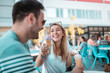 © Nebojsa - Young couple enjoying sunny weather and eating ice-cream