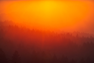 Smoke from the summer 2018 California wildfires glows under the setting sun