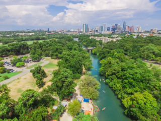 Aerial view Downtown from Barton Creek in Greenbelt at Zilker Metropolitan Park south Austin with summer blue cloud sky. Located at eastern edge of Hill Country, Austin the state capital of Texas, US.