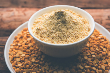 Besan, Gram or chickpea flour or powder is a pulse flour made from a variety of ground chickpea known as Bengal gram. popular ingredient for Pakora/pakoda or bajji snack. Selective focus