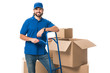 © LIGHTFIELD STUDIOS - handsome happy delivery man standing near cardboard boxes and smiling at camera isolated on white