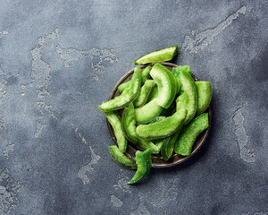 Poster - Dried pomelo slices on gray concrete background. Top view of candied fruits