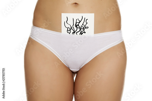 Woman In Panties With Pubic Hair Drawn On Sheet Of Paper On White
