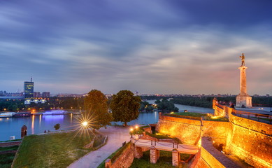 Wall Mural - Kalemegdan fortress and Victor monument Belgrade, Usce Sava and Danube confluence view at cloudy spring day