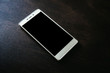 © 35mm - smart phone on dark wooden table