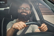 © arthurhidden - A modern bearded man driving a car