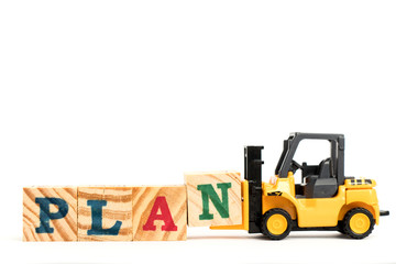 Canvas Print - Toy forklift hold letter block N to complete word plan on white background