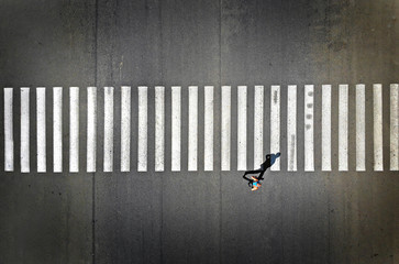 Aerial view of a pedestrian crosswalk with one footpassenger.