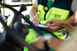 © Yakobchuk Olena - Taking notes. Close up of male hands writing down data on clipboard. Man holding pen while his colleague pointing at the document