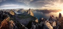 Mountainous panorma landscape view with huge fjords during golden sunset in Senja, Norway