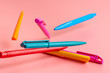 © troyanphoto - color pen on pink background Back to school Education with copy space colorful