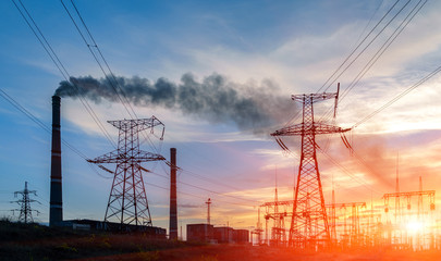 Wall Mural - thermal power stations and power lines during sunset