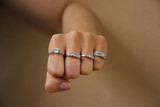 Fototapeta  - Close up of punch of woman wearing shiny diamond rings