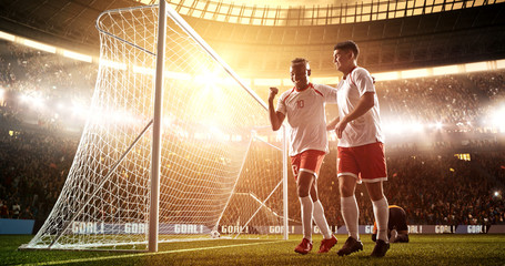 Wall Mural - Intense soccer moment in front of the goal on the professional soccer stadium.