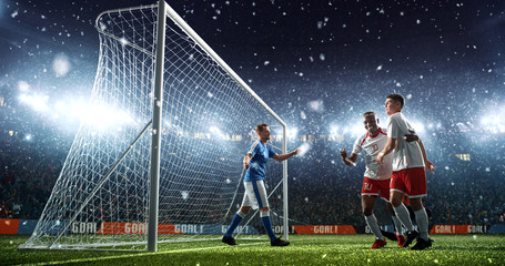 Wall Mural - Intense soccer moment in front of the goal on the professional soccer stadium.