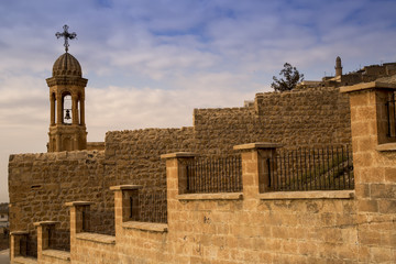 Wall Mural - A bell tower in Mardin,Midyat. Midyat is a old town in Turkey. A town of muslims and syriac people who living together.