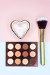 © Roman - Brushes and makeup shadows on a beautiful background