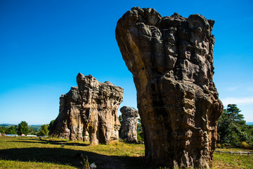 old stone in summer with cloud and blue sky