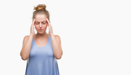 Wall Mural - Young blonde woman with hand on head for pain in head because stress. Suffering migraine.