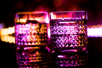 bar colored lights with glasses of alcohol