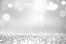 White Silver Glitter And Grey Lights Bokeh With Stars Abstract Background Holiday.