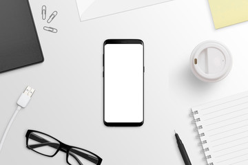 Poster - Phone with round edges on white desk. Isolated screen for app or web site presentation mockup. Flat lay. Top view.