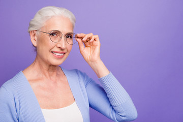 Sticker - Portrait of grey haired old smiling woman wearing glasses, holdi