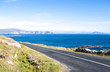 Ocean road with the Minaun Cliffs in the background. Taken on a sunny summer day on Achill Island along the Wild Atlantic Way.